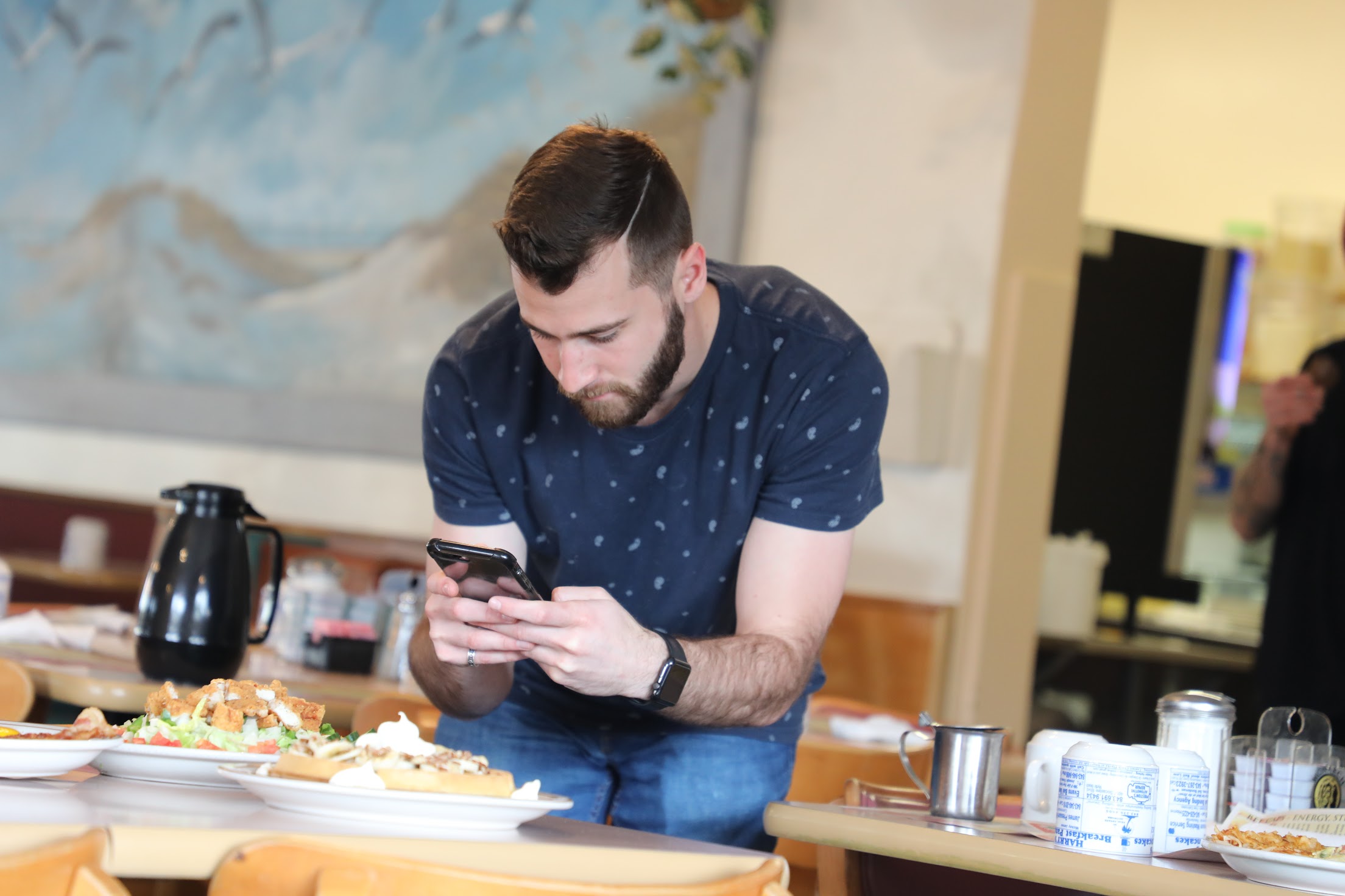 Joshua Weinstein creating marketing content for a local restaurant